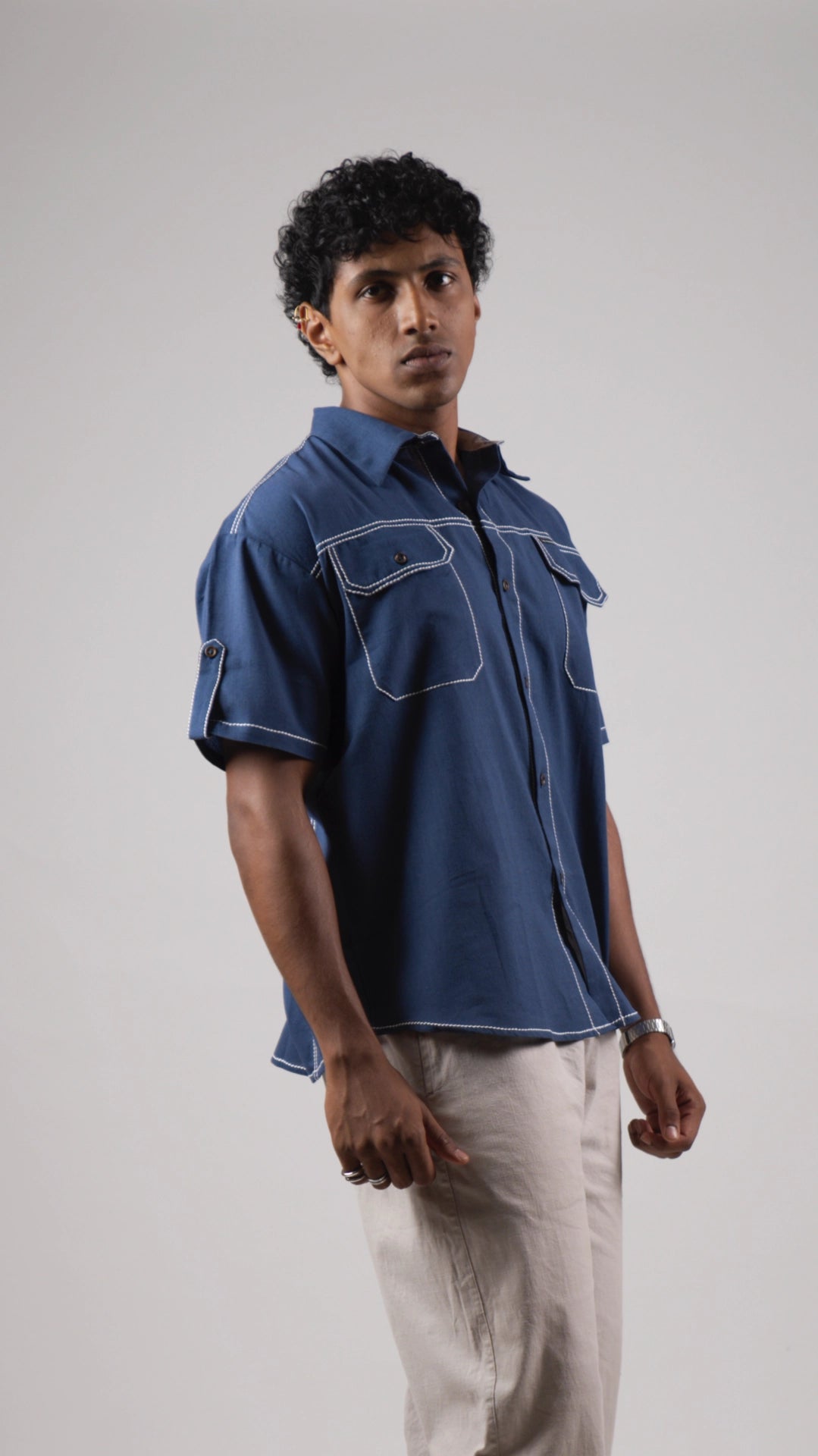 Man wearing a blue cotton linen half-sleeved shirt