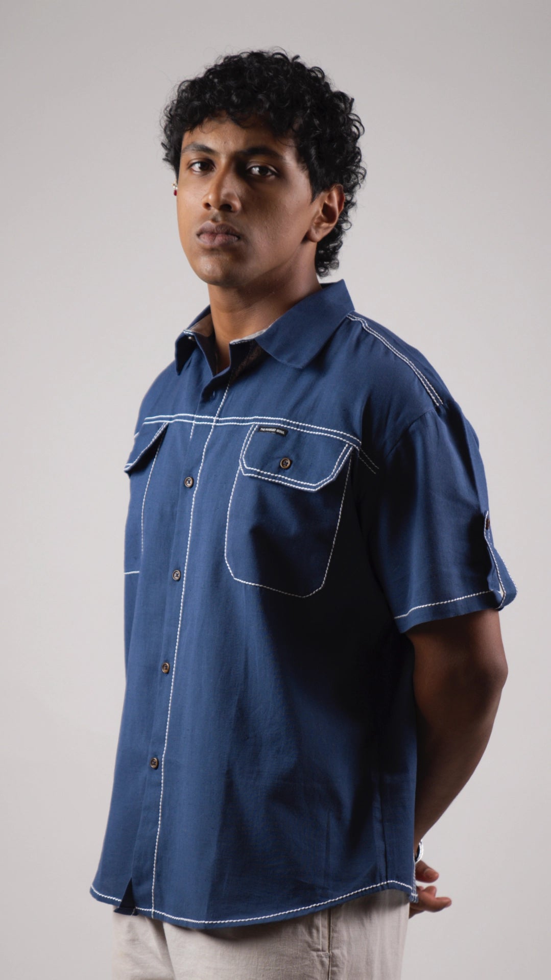 Man wearing a blue cotton linen half-sleeved shirt