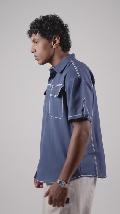 Video of a man posing in a blue cotton linen half-sleeved shirt