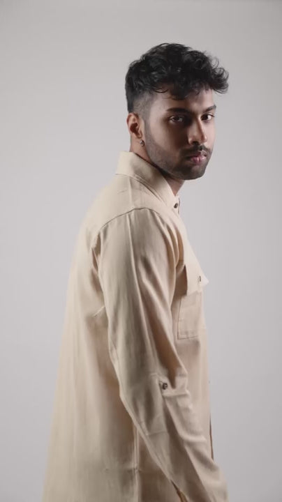 closeup video of model posing in a beige coloured cotton linen shirt