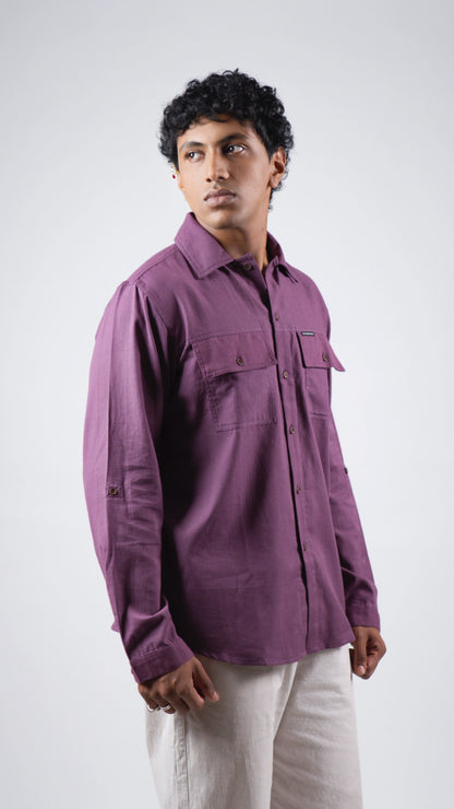 Man wearing a purple shirt on a white background