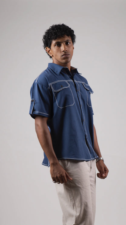 Man wearing a blue cotton linen half-sleeved shirt