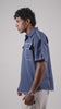 Video of a man posing in a blue cotton linen half-sleeved shirt