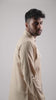 closeup video of model posing in a beige coloured cotton linen shirt