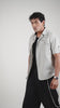 Video of a man posing in a cotton linen gray half sleeve shirt 
